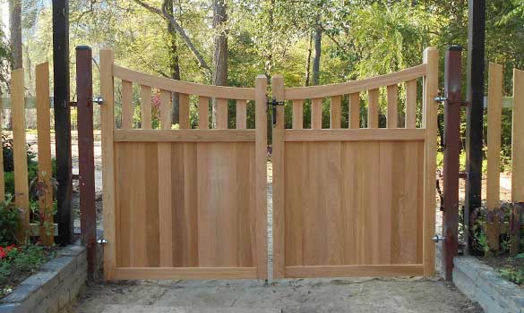 A decorative wood walkway gate.
